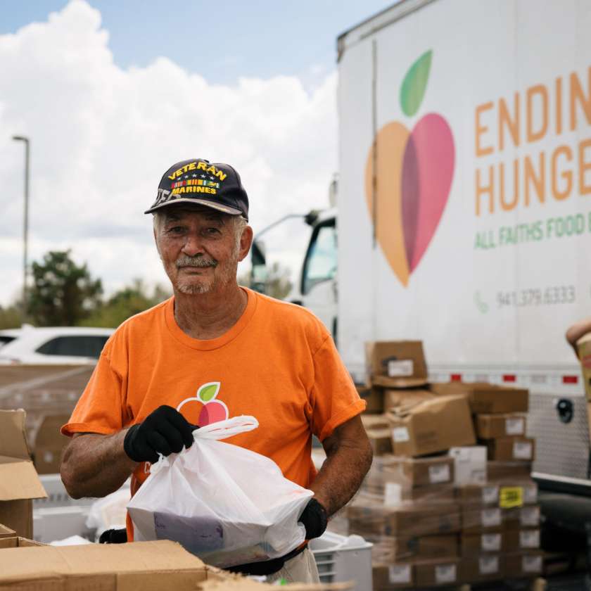 Veteran helps with food distribution at All Faiths Food Bank Photo by GCCF
