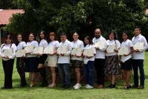 Graduates of 21st generation of instructors holding their diplomas