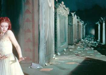 Moira Shearer dancing past tombs in a scene from The Red Shoes