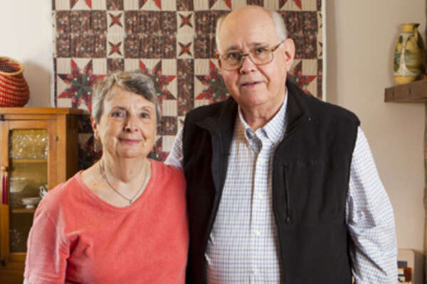 Randy and Louise Hembree standing together in their home